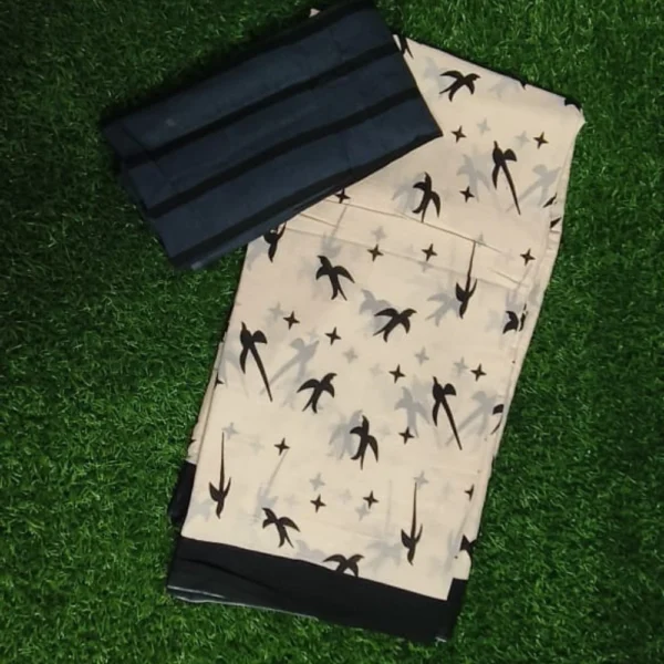 Whispering Wings – Skin Sandal & Black Mul Mul Cotton Saree with Parrot Shadow Motifs